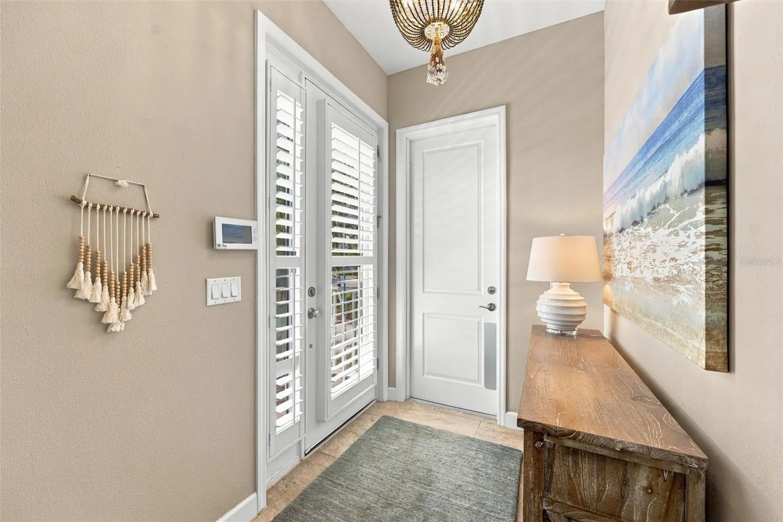 Welcome through the front entry, with convenient access to the second level by either stairs or elevator.