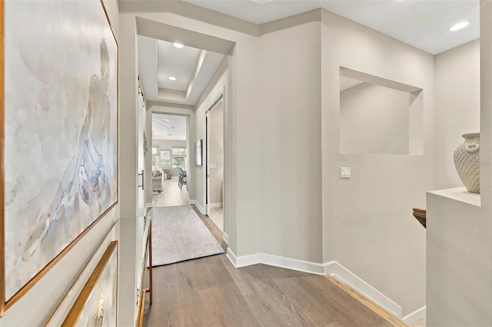 Hallway up the stairs that lead to the Bonus Room, Kitchen and Living Room area.