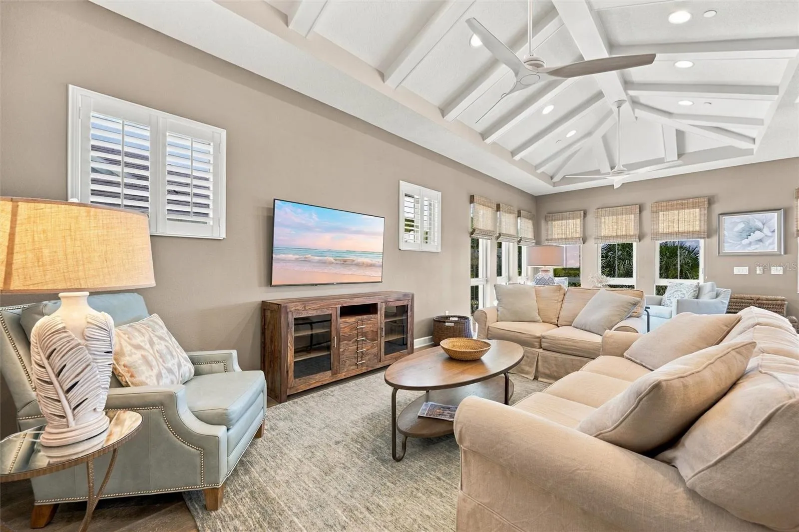 Enjoy peaceful Sapphire Lake views from this beautifully appointed home, featuring an open-concept floor plan, soaring vaulted ceilings, and Mohawk engineered hardwood flooring.