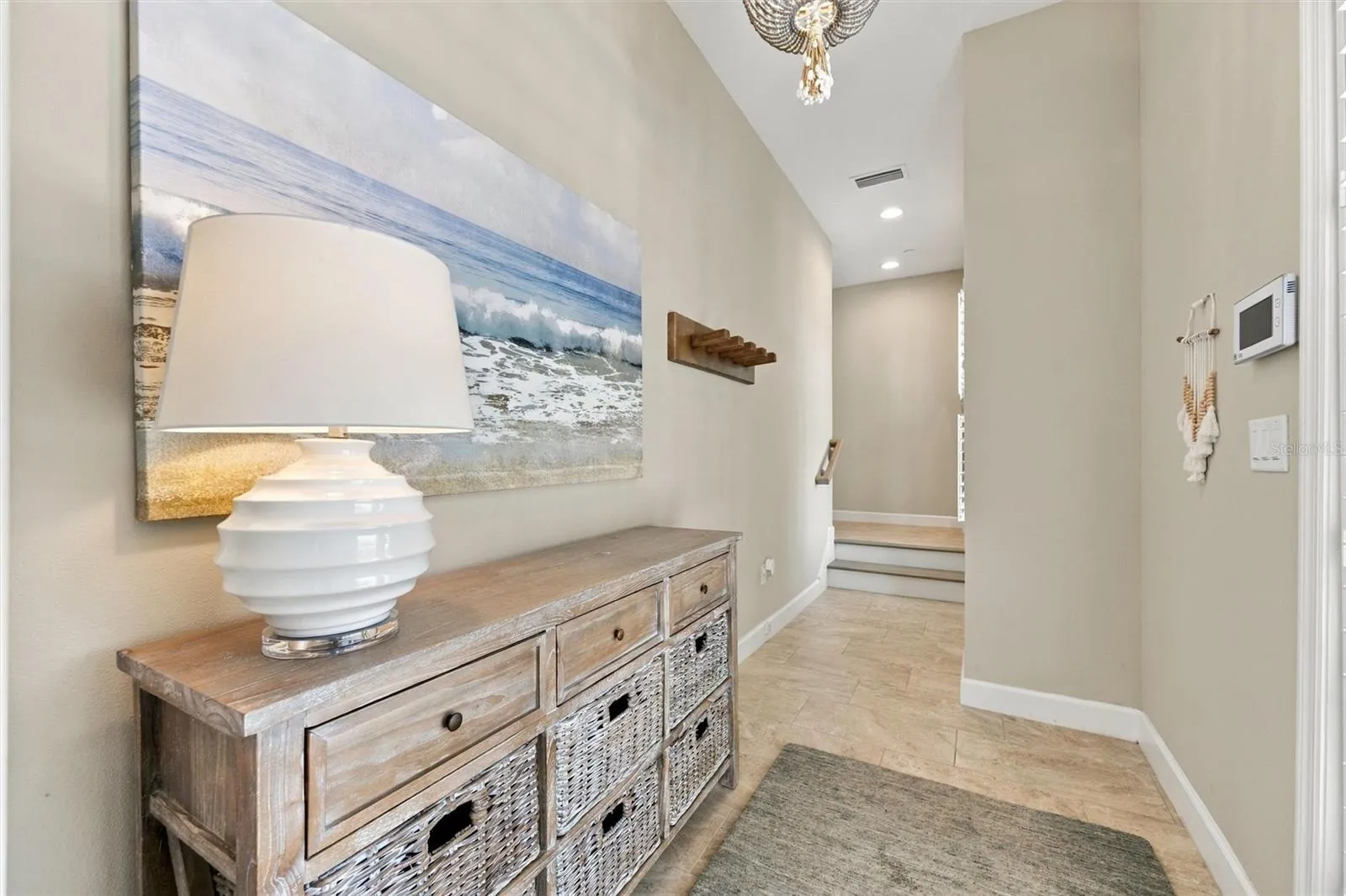Welcome through the front entry, with convenient access to the second level by either stairs or elevator.