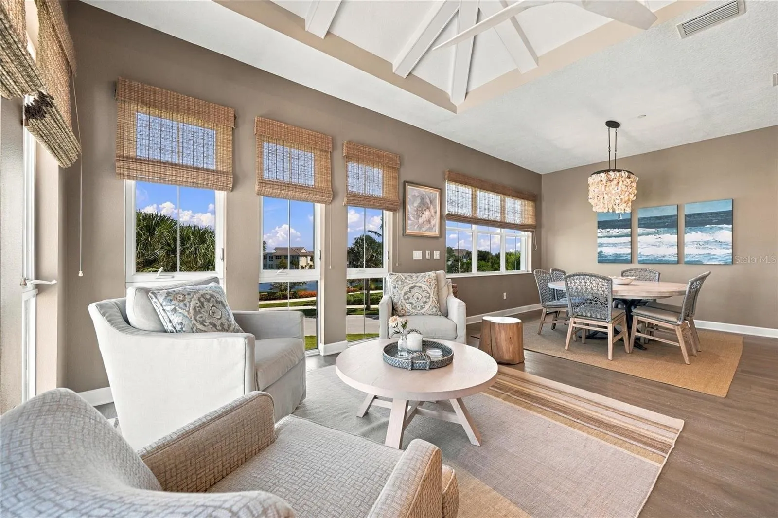 Enjoy peaceful Sapphire Lake views from this beautifully appointed home, featuring an open-concept floor plan, soaring vaulted ceilings, and Mohawk engineered hardwood flooring.