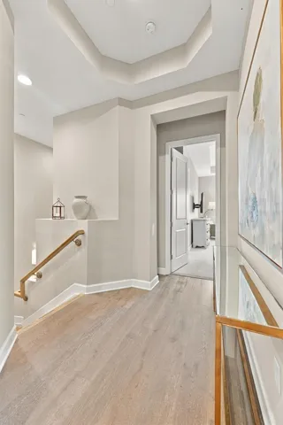 Hallway up the stairs that leads to the Primary Bedroom, 2nd Bedroom and Elevator.
