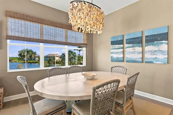 Enjoy peaceful Sapphire Lake views from this beautifully appointed home, featuring an open-concept floor plan, soaring vaulted ceilings, and Mohawk engineered hardwood flooring.