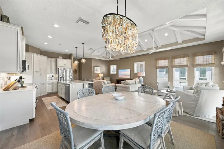 Enjoy peaceful Sapphire Lake views from this beautifully appointed home, featuring an open-concept floor plan, soaring vaulted ceilings, and Mohawk engineered hardwood flooring.