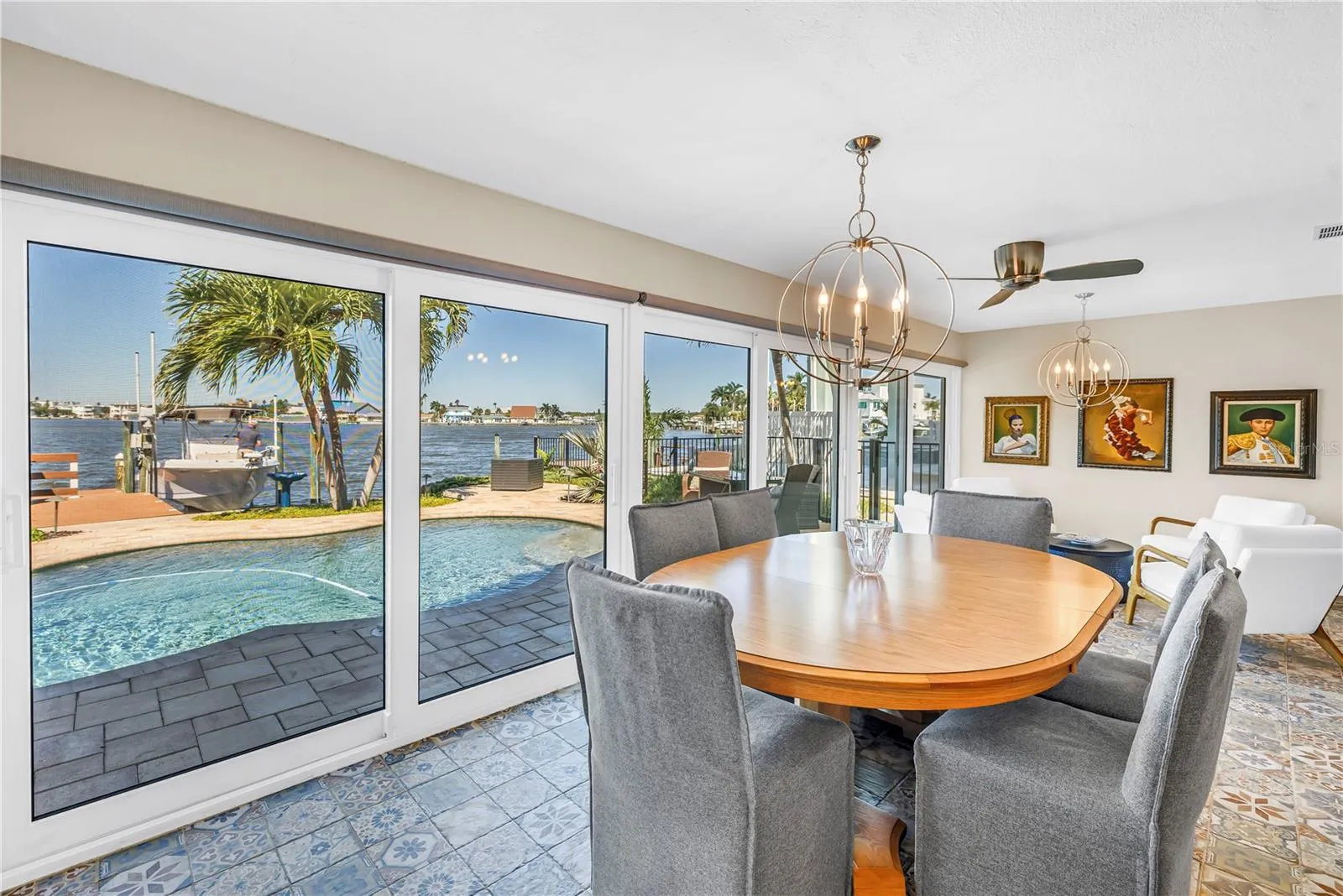 Dining Area with View of Pool and Water