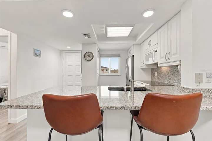 Breakfast Bar with Pass Through Opening to Kitchen