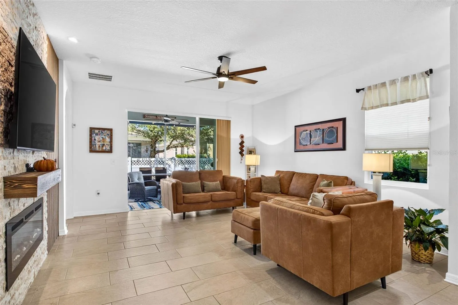 Living room sits by the 3 panel sliders.