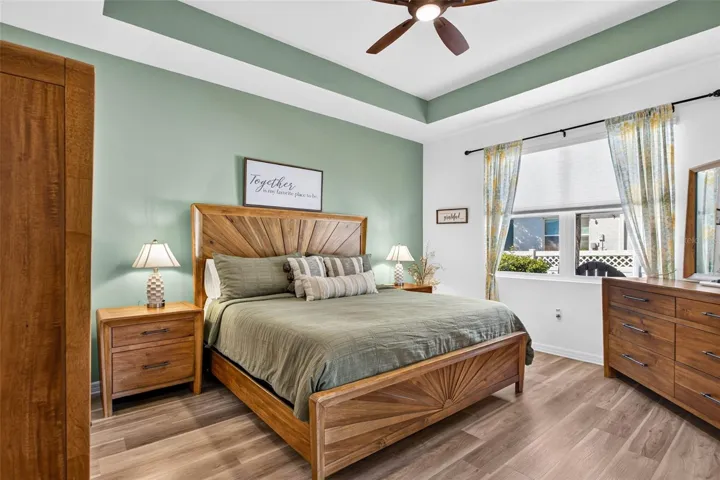 LVP flooring & tray ceiling bring an accent to this room.