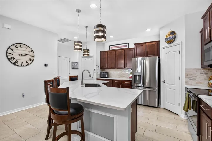 Stainless steel appliances & quartz countertops.