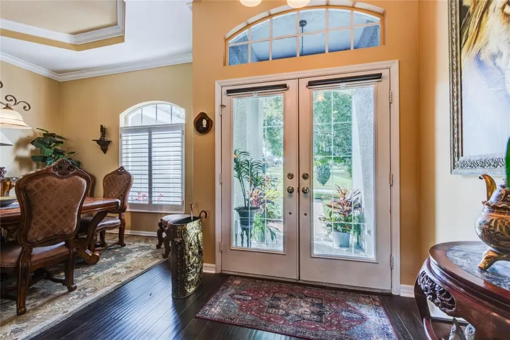 Double glass doors open to a serene golf course view at front too!