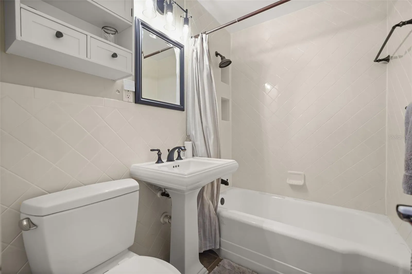Bathroom with tub and shower combination