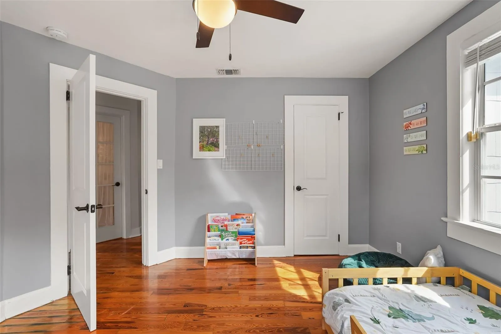 Bedroom with closet and ceiling fan
