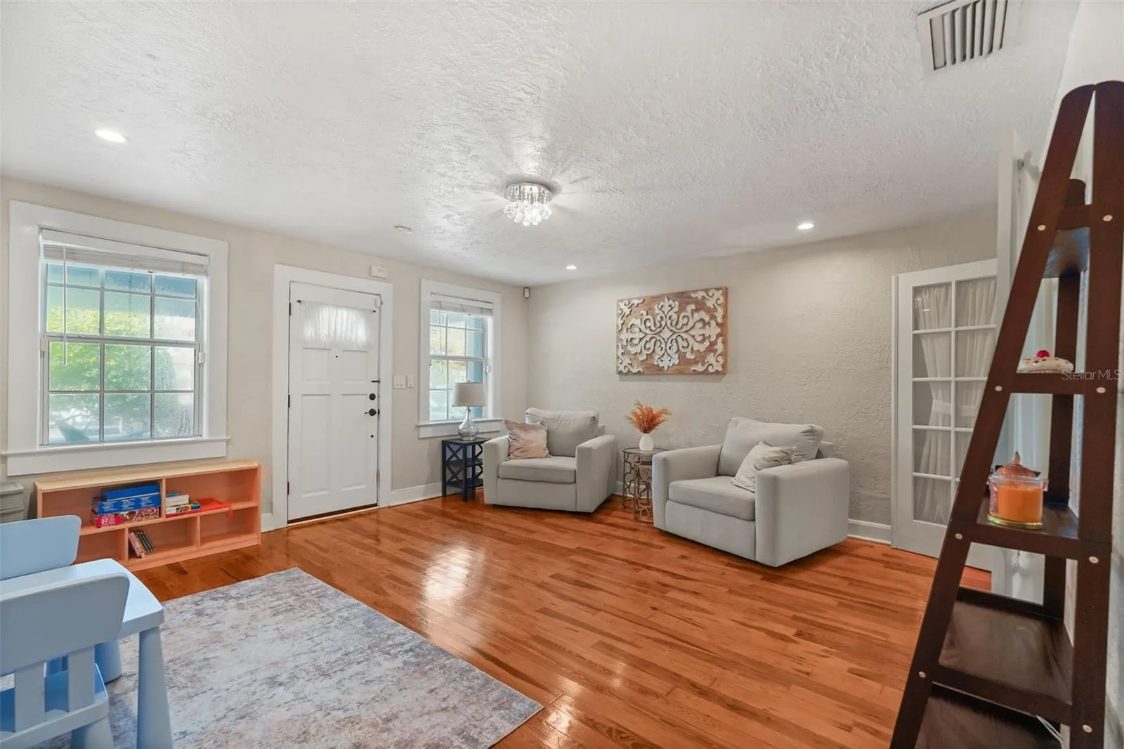 Front family room with wood floors and French doors