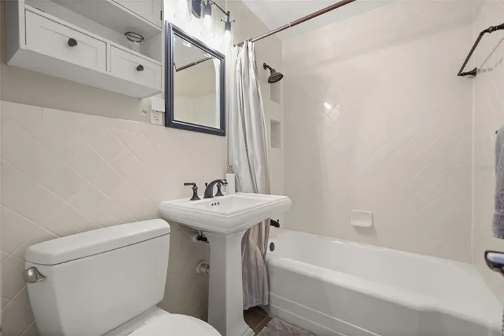 Bathroom with tub and shower combination