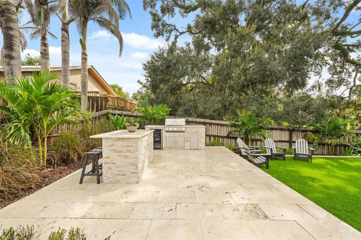 Outdoor kitchen and backyard turf