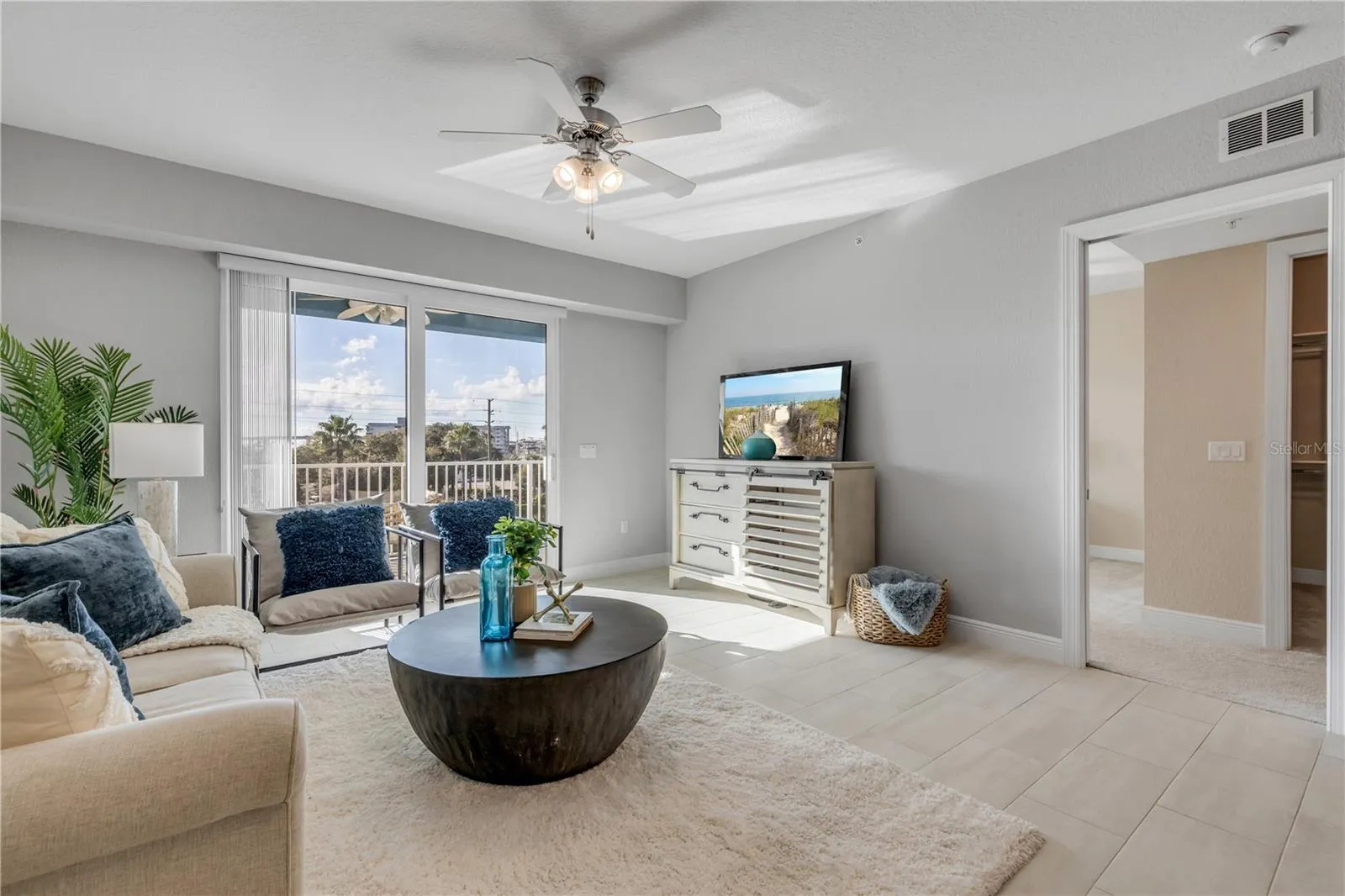 Living Room with large slider to the back patio