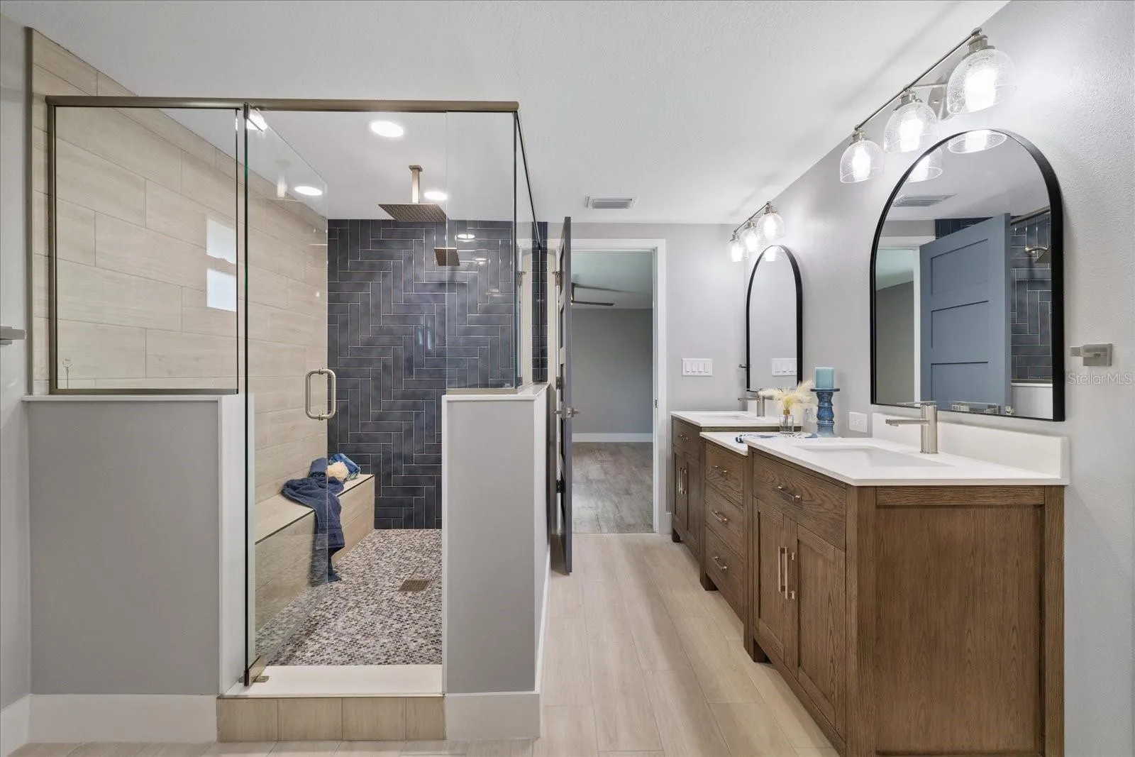 Large walk-in shower with ledge in primary