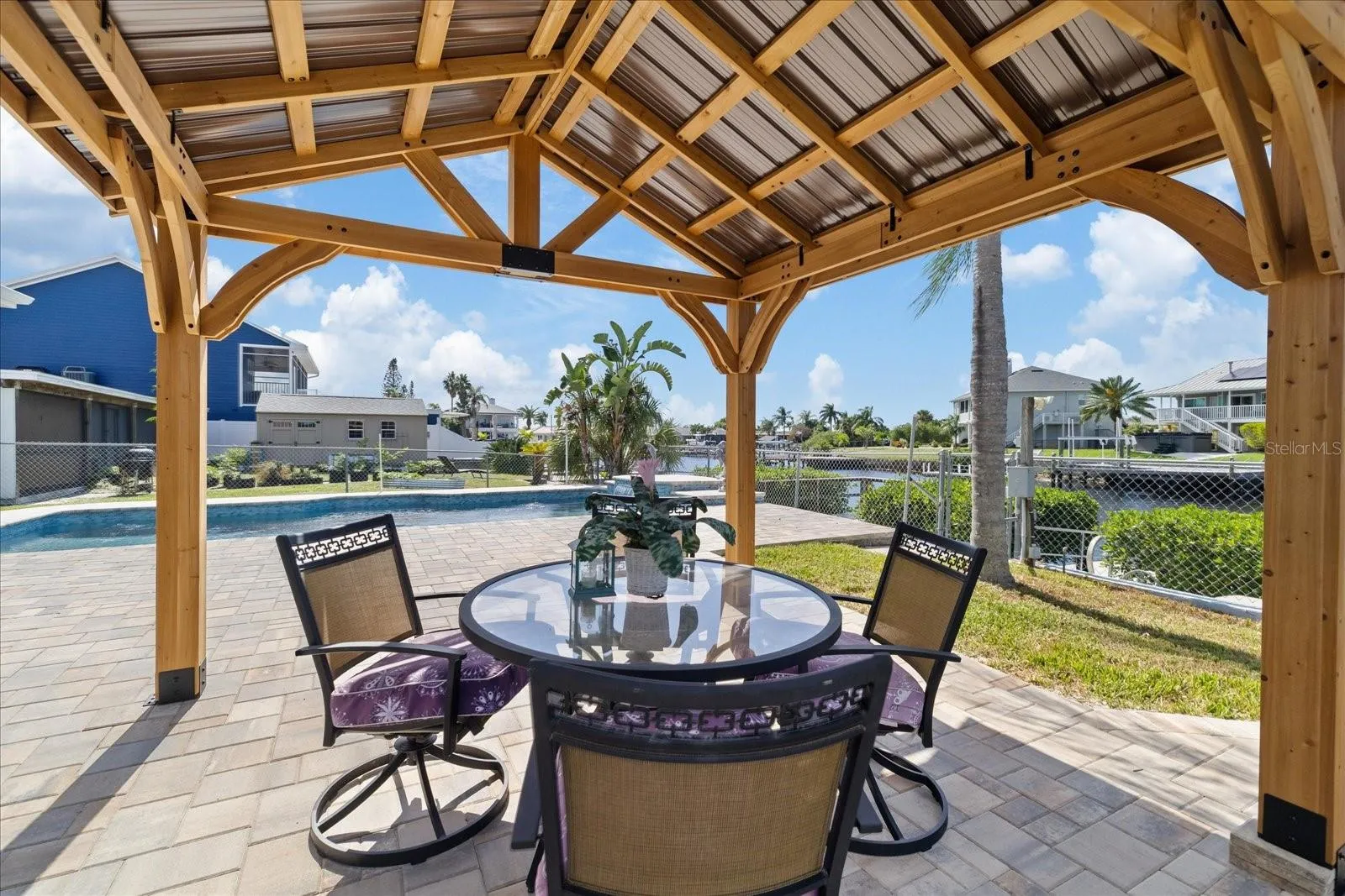 Gazebo shaded area on pavered pool deck