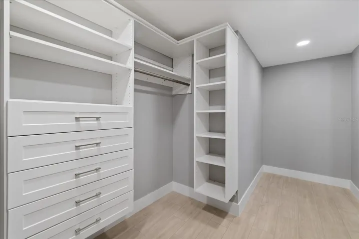Walk in custom closet in primary