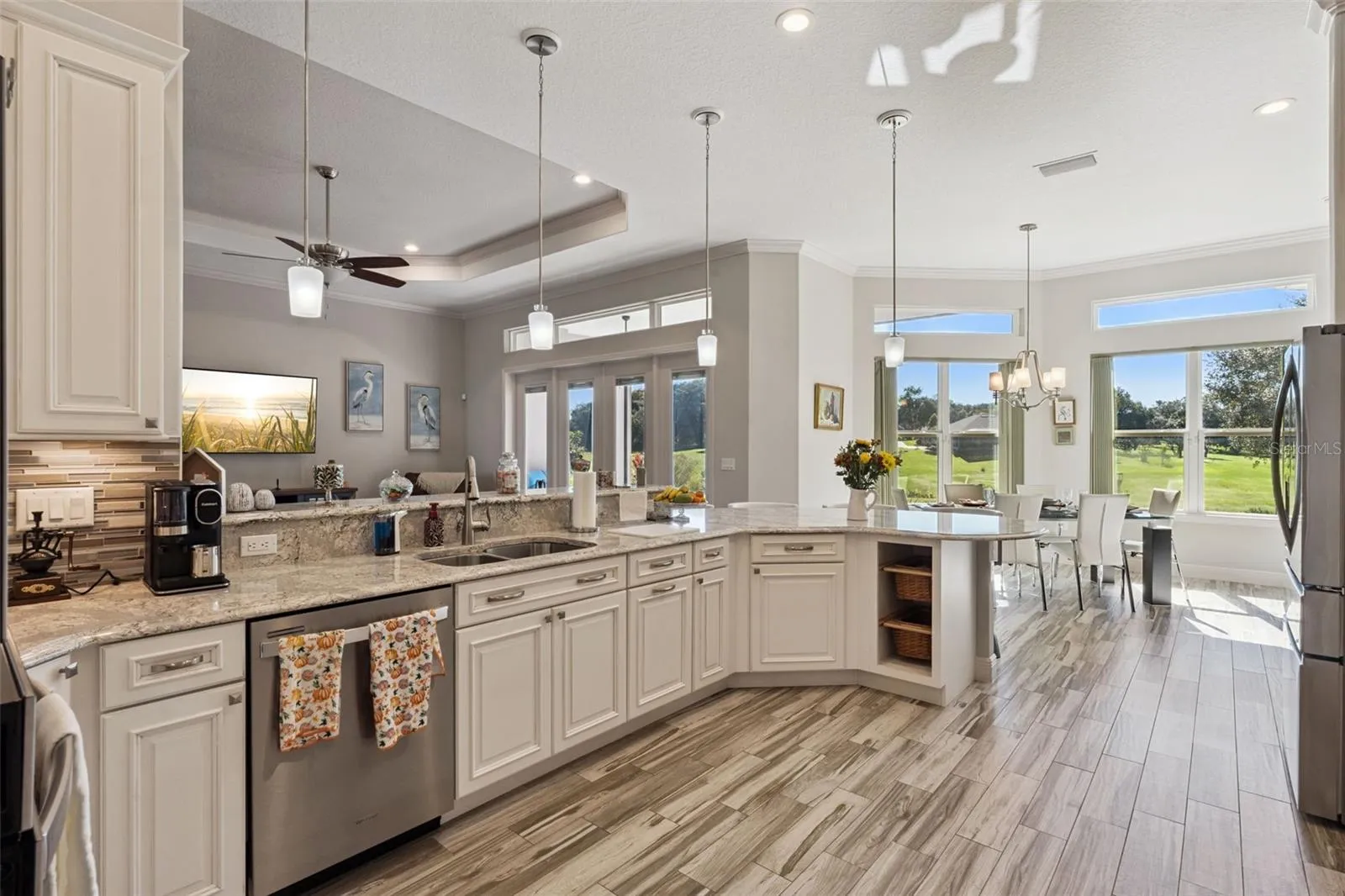 This kitchen is a chefs delight with quartz countertops, 42" cabinets and stainless appliances