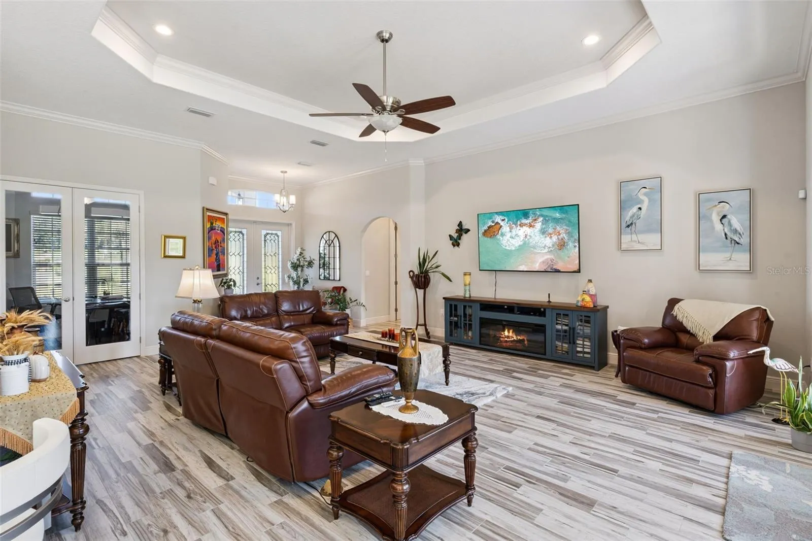 Trey ceiling in family room with view of french doors that lead to private office