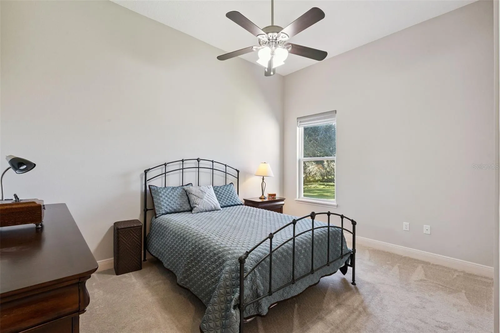 Bedroom 3 features a spacious walk-in closet, a ceiling fan for climate control, and a neutral paint palette that serves as a perfect blank canvas for any décor style.