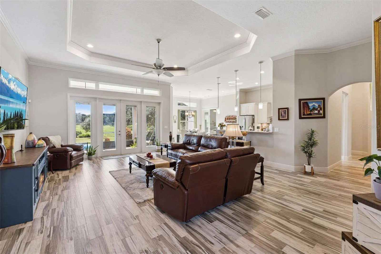 Welcome guests through the front double door into the open floor plan with family room with a beautiful water view