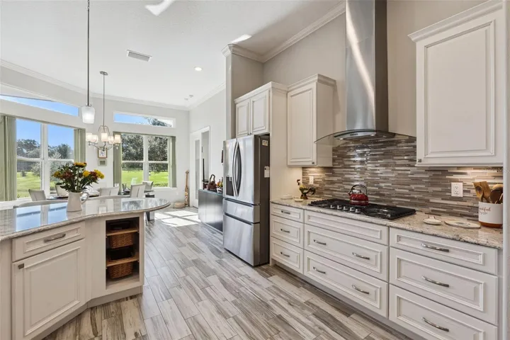 Stacked glass block backsplash, gas stove and stainless venthood