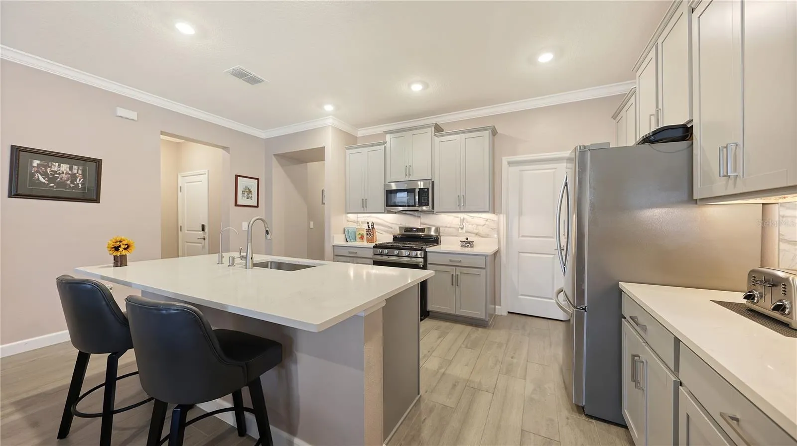 Kitchen with wood cabinets and pull out drawers in every cabinet