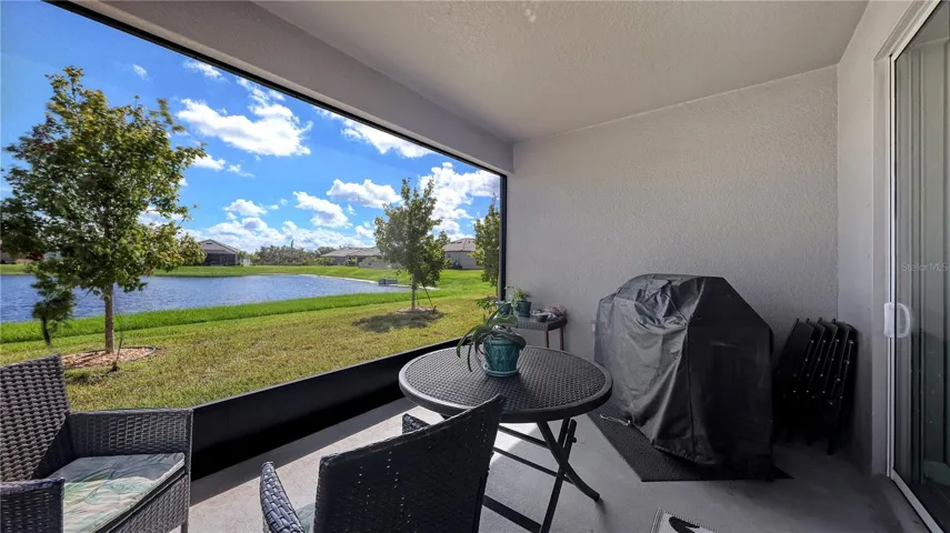 Covered and screen enclosed Back porch with lakeview