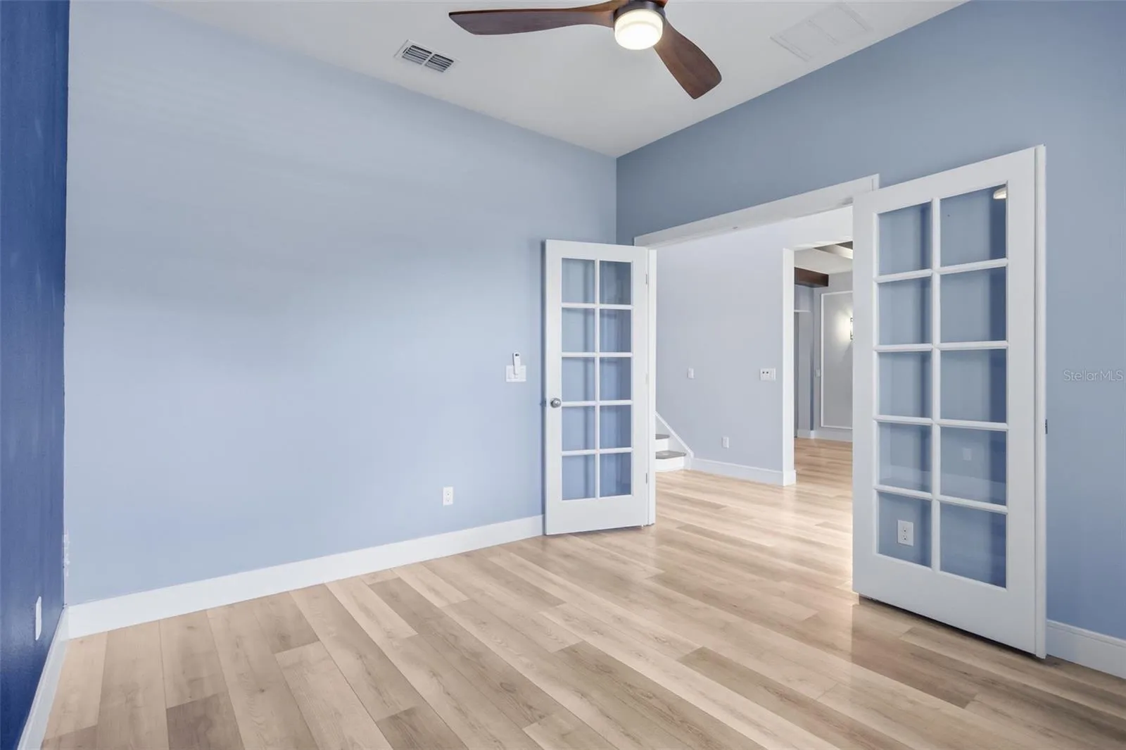 Double doors into the office at the front of the home