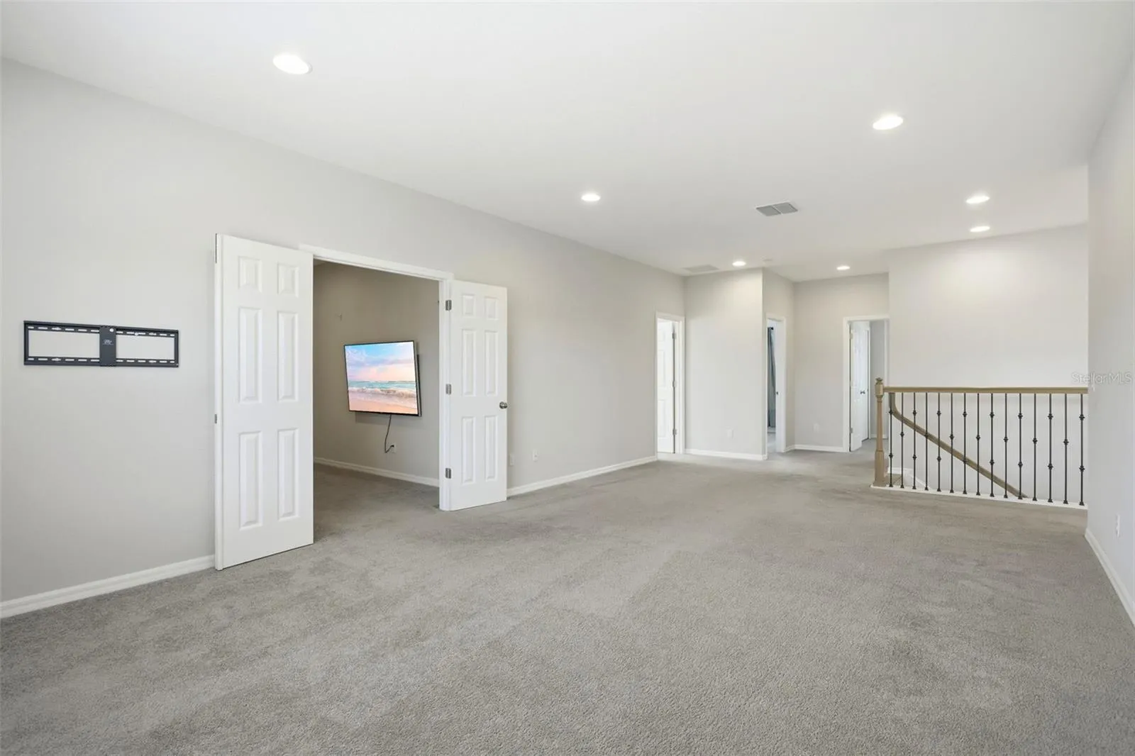 Double door lead into the separate media room
