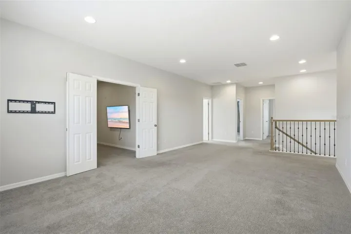 Double door lead into the separate media room