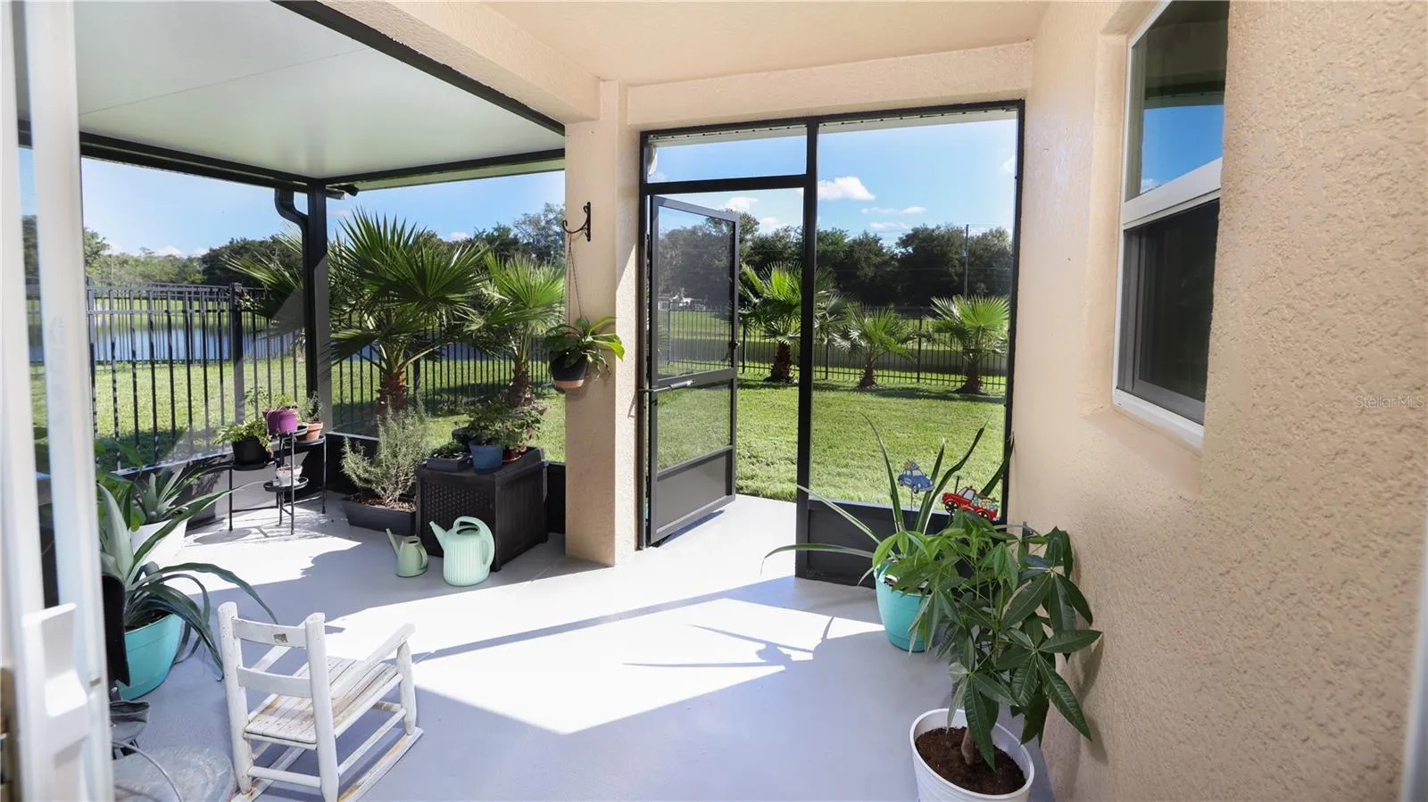 View from your Backporch! This WATERFRONT Retreat is so Private, You Will not be able to See ANY Neighbors from Your SCREENED Back Porch…You will only see Thousands of Dollars in Gorgeous Palm Trees, and beyond that just Water Views and Wildlife!