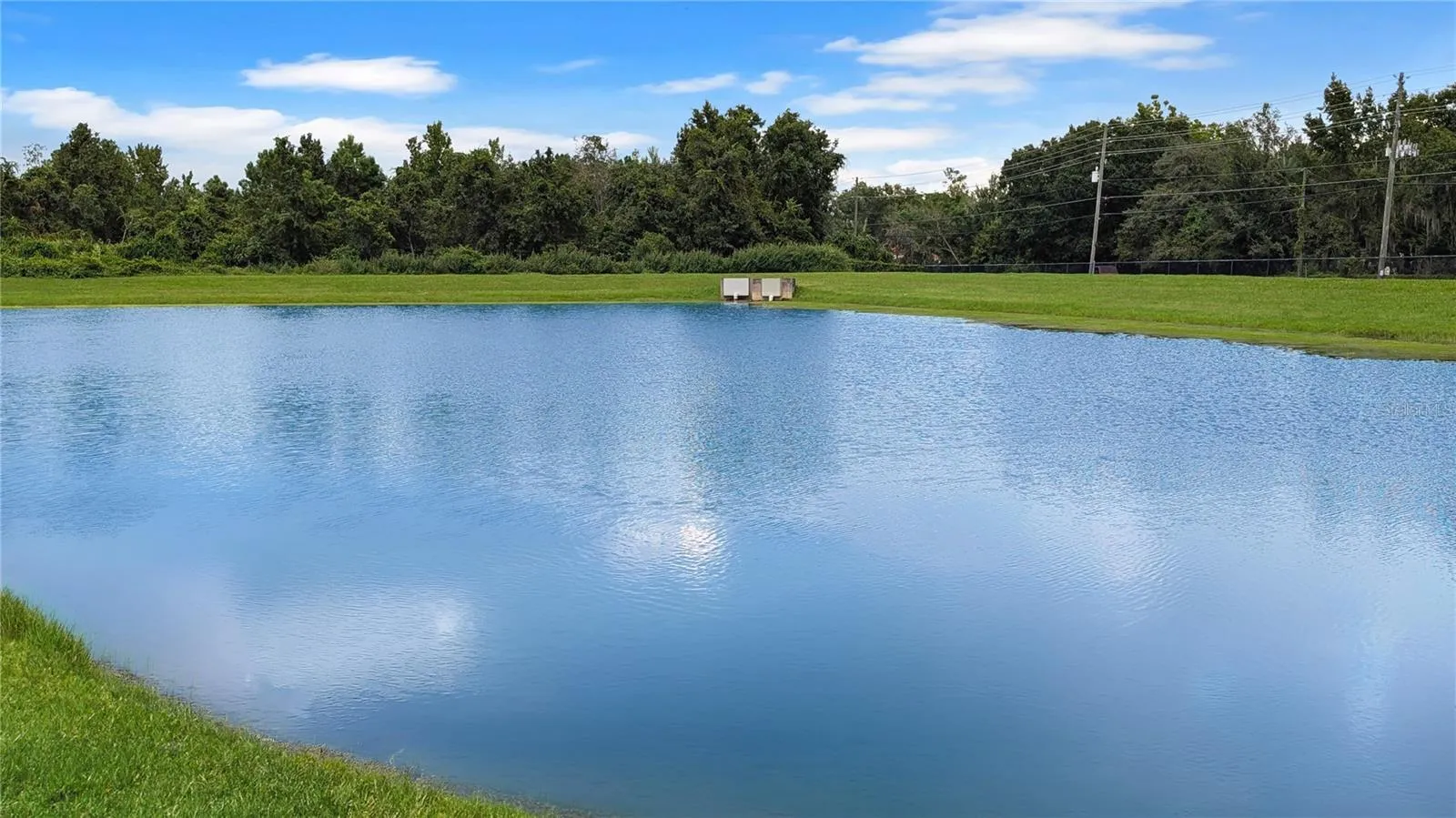 This WATERFRONT Retreat is so Private, You Will not be able to See ANY Neighbors from Your SCREENED Back Porch…You will only see Thousands of Dollars in Gorgeous Palm Trees, and beyond that just Water Views and Wildlife!