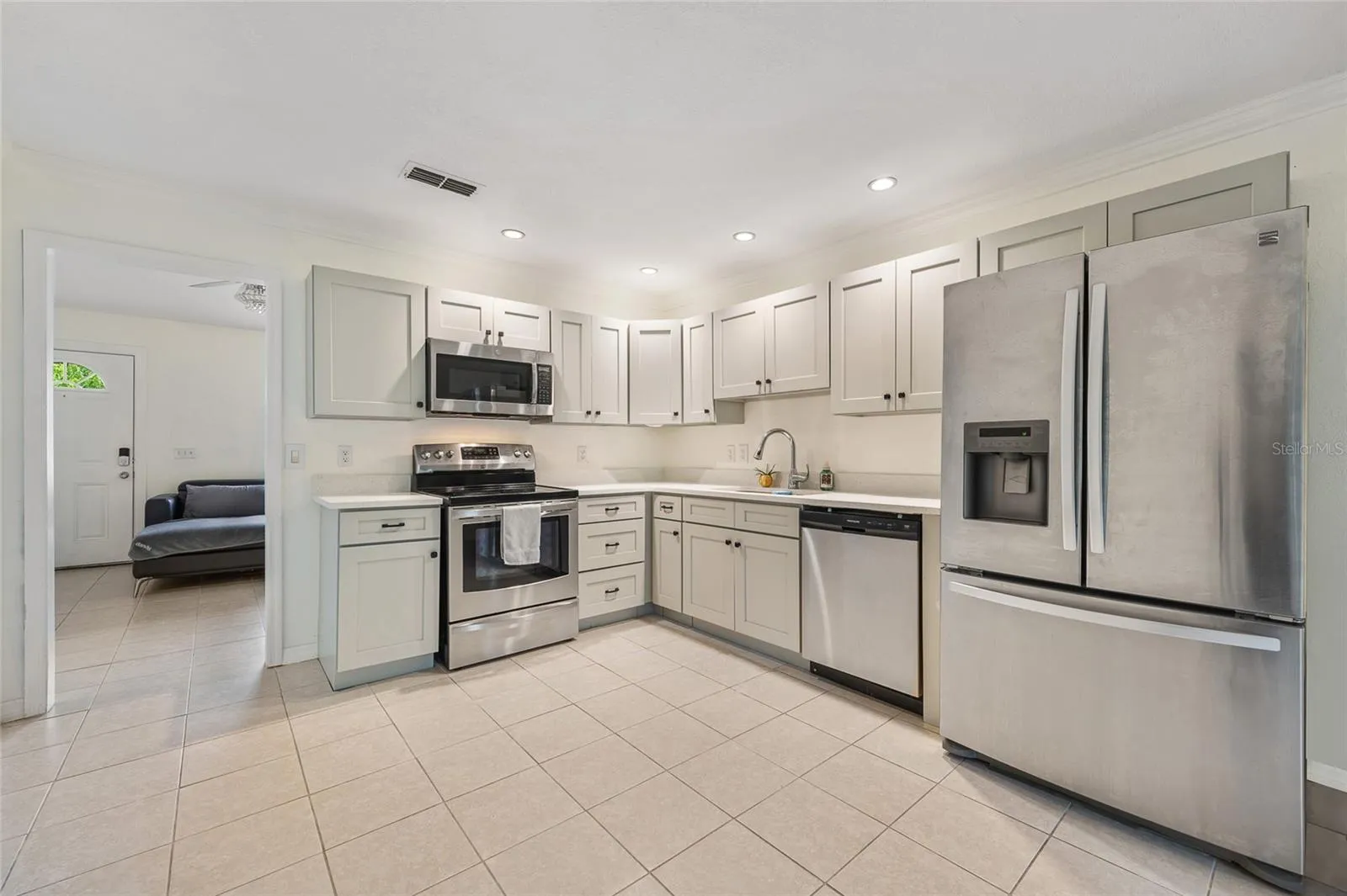 Kitchen area leading to living room.