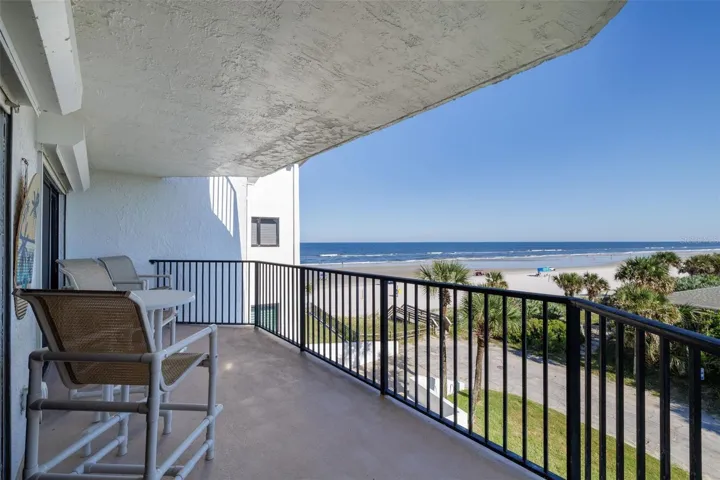 Spacious balcony overlooks the sandy beach & spectacular sunrises & sunsets.