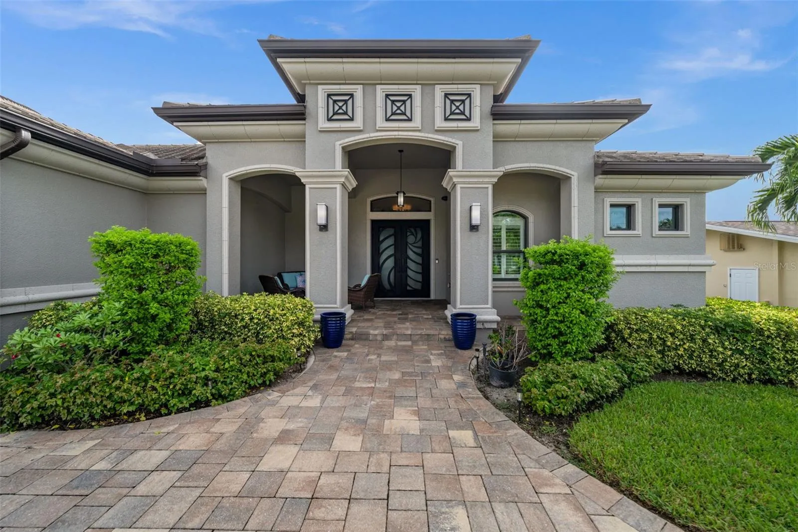 Welcoming, impressive entrance with the custom steel entry doors.