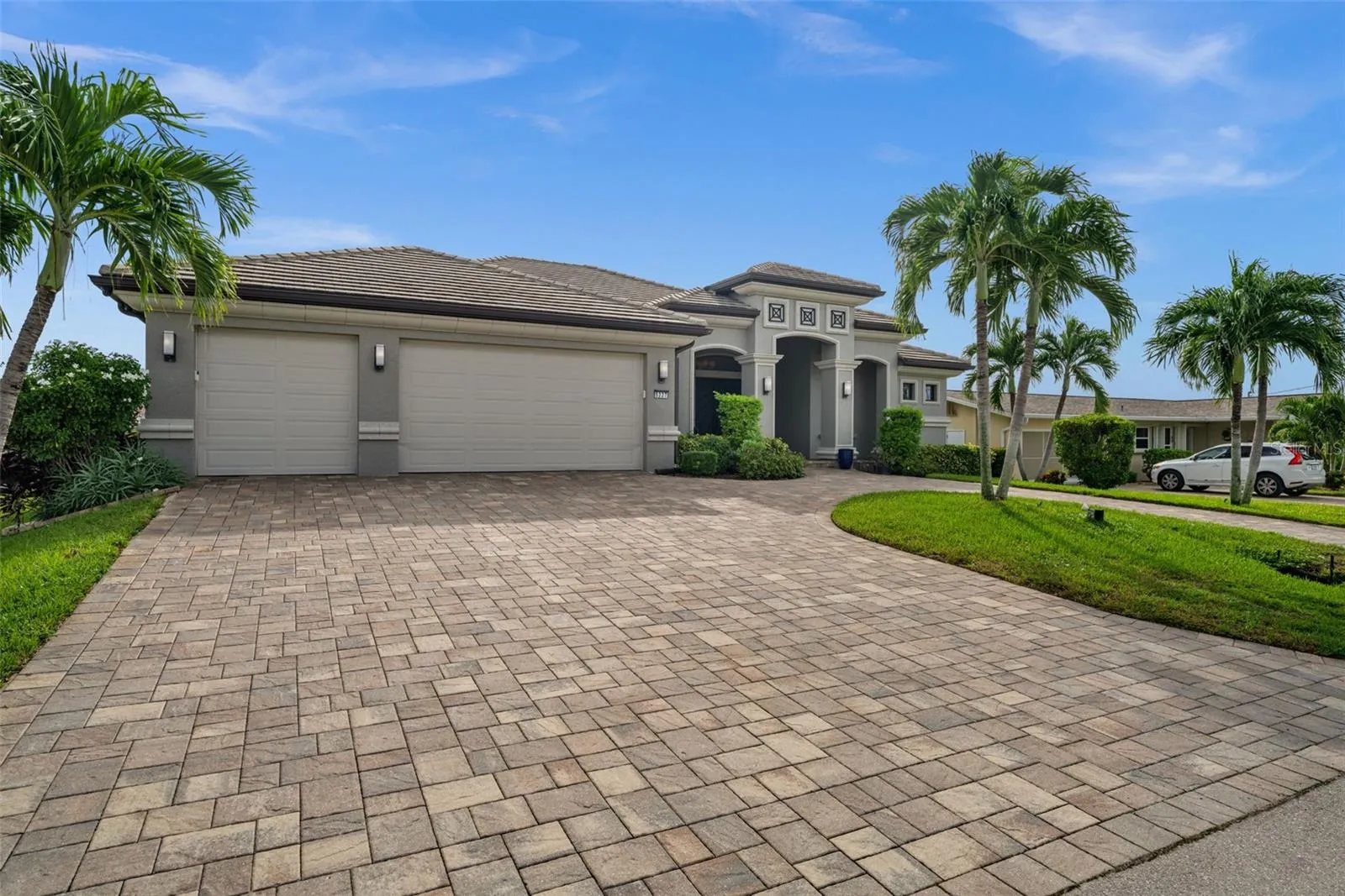 Paver driveway to the oversized 3 car garage