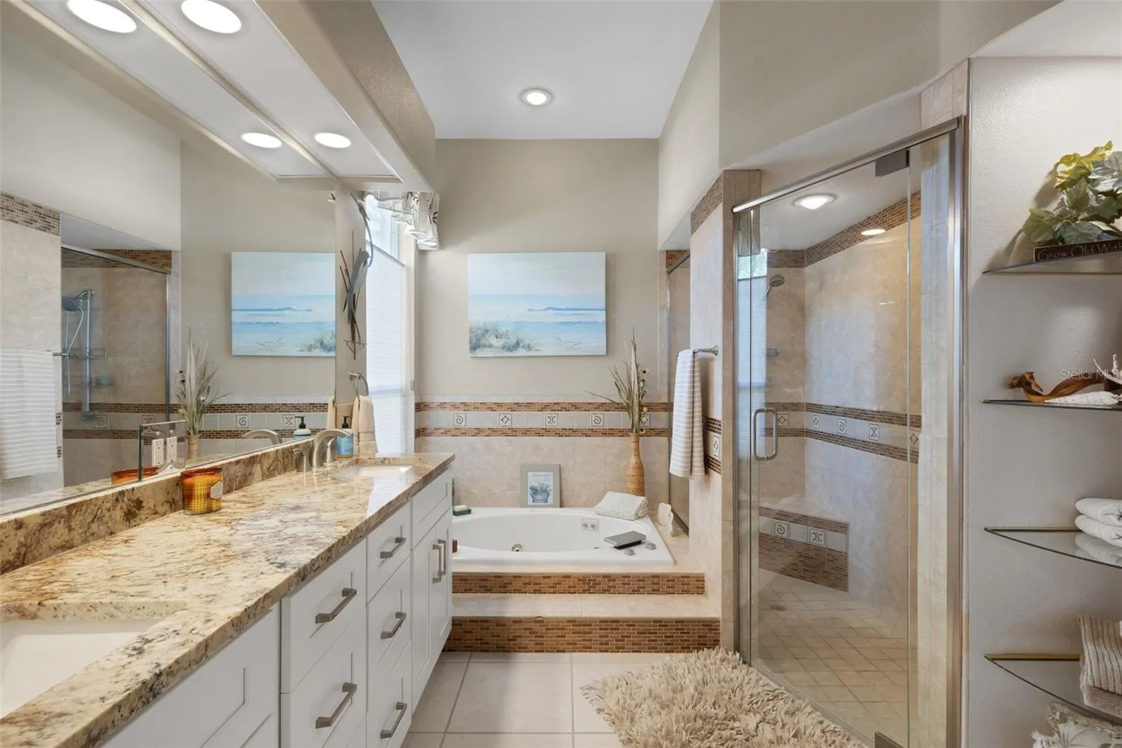Primary Bathroom Dual sinks, separate shower and tub.