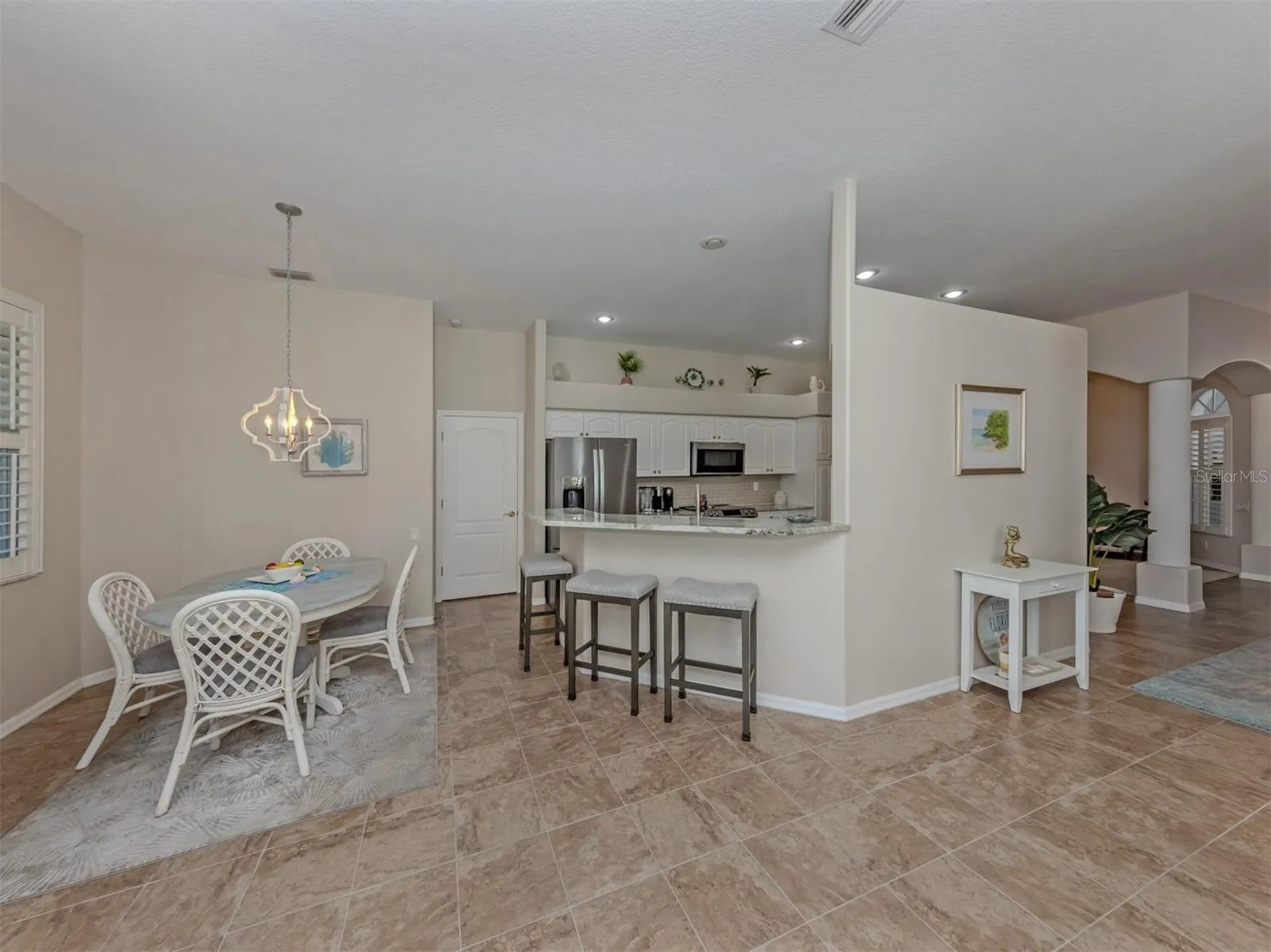 Beautifully connected and thoughtfully arranged, this inviting space brings together the kitchen, breakfast nook, and breakfast bar with comfortable seating, creating a delightful setting where everyday moments and good company come naturally!