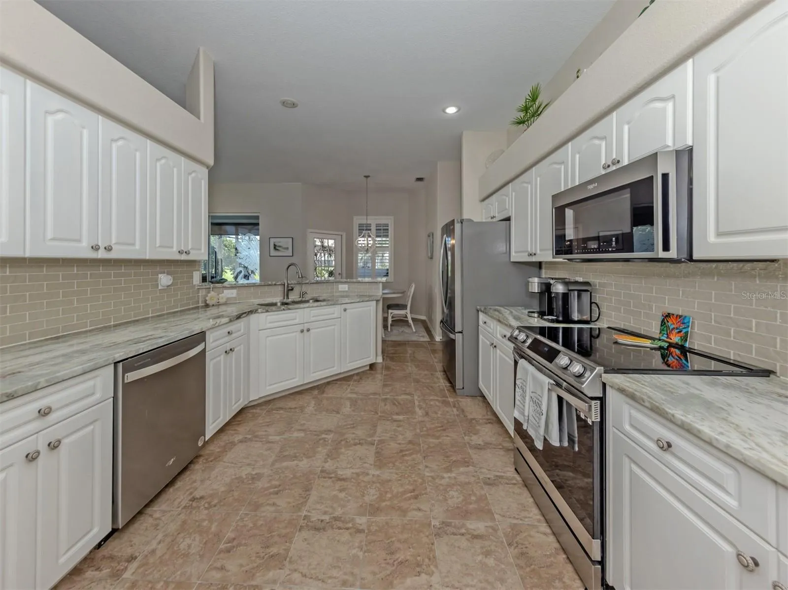 Where style meets everyday convenience! This thoughtfully designed kitchen offers generous counter space, an inviting layout, and all the little touches that make cooking and entertaining a pleasure!