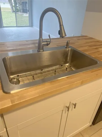 Updated kitchen countertops and kitchen sink.