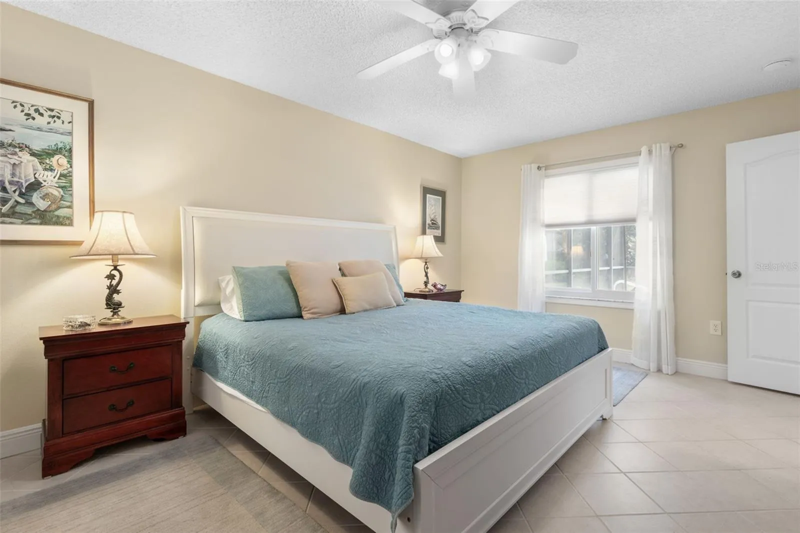 Imagine waking up to the Florida sunshine with a glimpse of your sparkling pool just beyond the window. This primary bedroom brings a little vacation feeling to every morning!