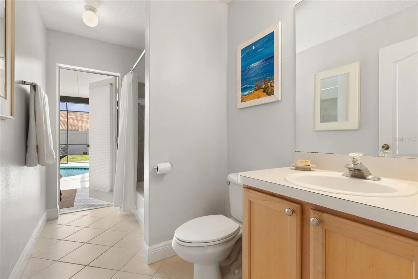The guest bath offers convenient access to the pool area, making it easy to rinse off and return to the sunshine without tracking through the house.