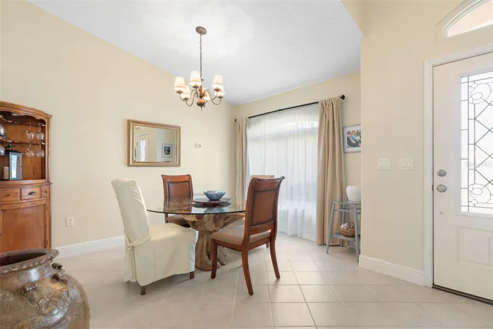 Set the table for memorable dinner parties and holiday celebrations! This charming formal dining room offers an intimate setting, with soft natural light and an elegant chandelier adding a touch of sophistication to every occasion.