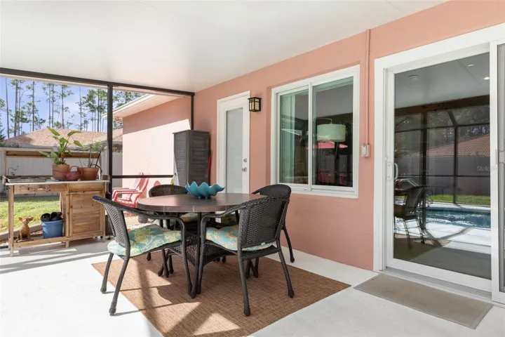 The covered patio offers a shady escape from the Florida sun, with convenient access to the screened pool just steps away. Whether enjoying the outdoors or taking a refreshing dip, relaxation is always within reach!