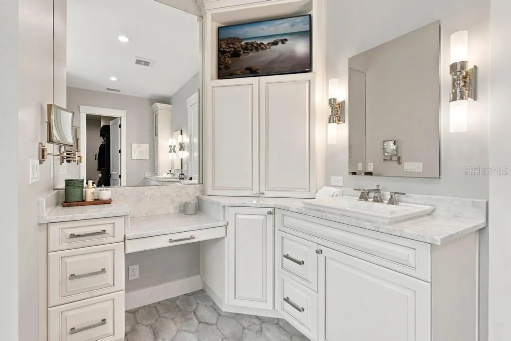 Custom vanity with quartz counter tops and make-up station