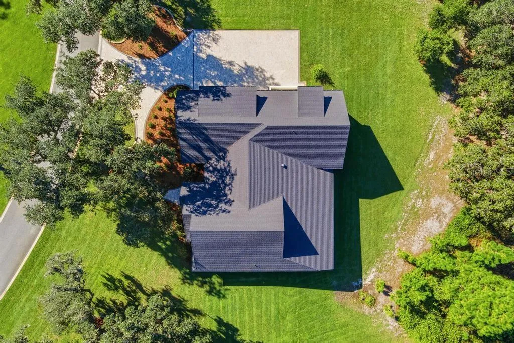 Ariel of home showing long lasting "STONE COATED" METAL ROOF