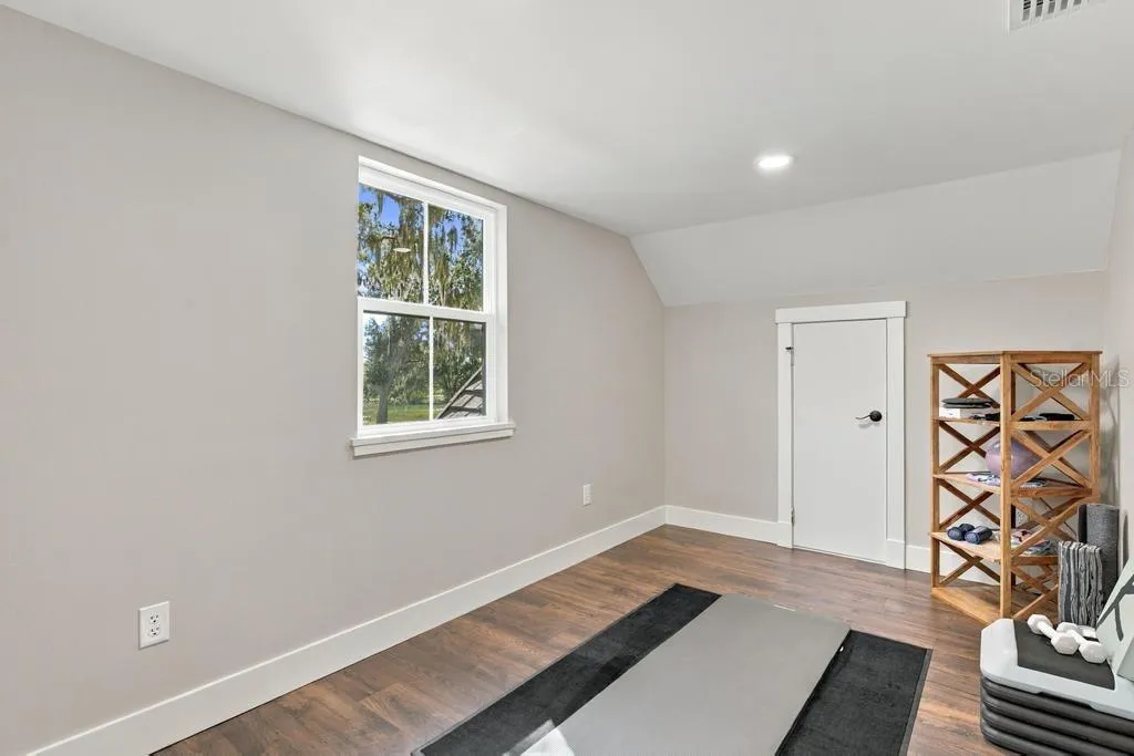 Upstairs flex or play space... great fitness room with closet!